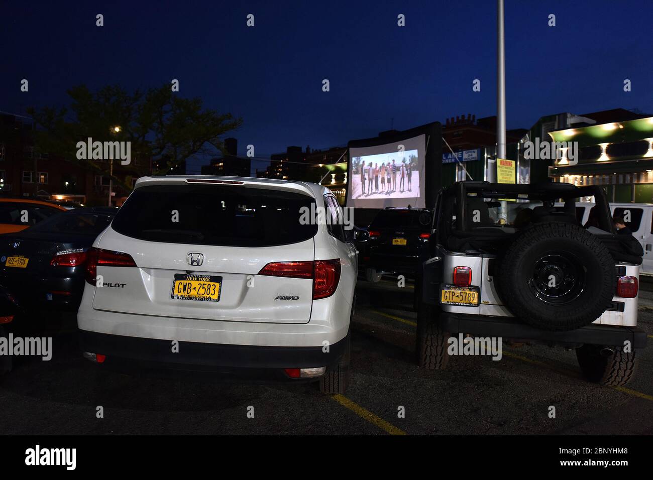 New York City, USA. 16th May, 2020. Bel Aire Diner in the Astoria neighborhood of Queens, has been transformed into a drive-in movie theatre during the COVID-19 pandemic, New York, NY, May 16, 2020. With restaurants limited to take-out under Coronavirus city rules, Bel Aire Diner allows motorist who reserved spots in their parking lot to order from the diner as they watch a movie. (Anthony Behar/Sipa USA) Credit: Sipa USA/Alamy Live News Stock Photo