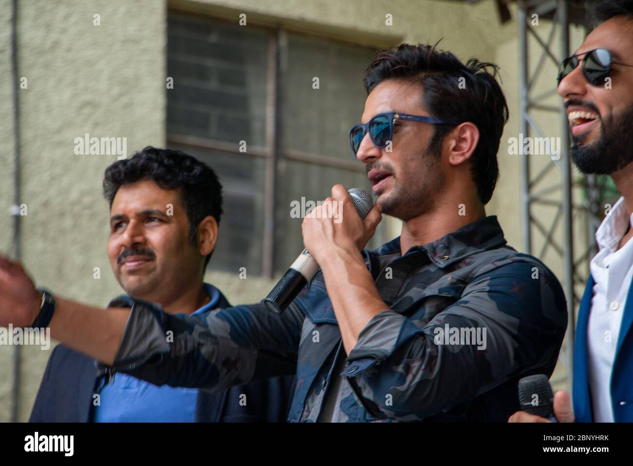 New Delhi, Delhi / India - 08/11/2016: Bollywood actor Sushant Singh Rajput at the trailer launch of MS Dhoni movie at his school with Mahendra Singh Stock Photo