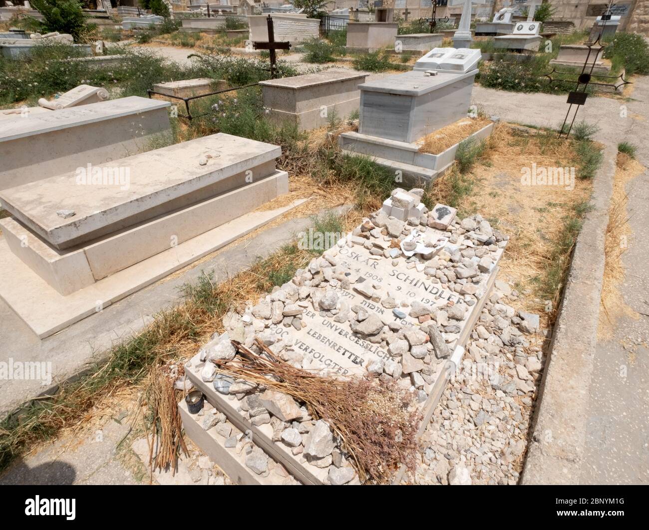 Jerusalem, Israel. 17th June, 2019. Stones lie on the grave of the entrepreneur Oskar Schindler on the Zionsberg in Jerusalem. With 'Schindler's List' director Spielberg has created a monument to him. Schindler, who died in 1974, is one of the most famous protagonists of the Second World War. With the rescue of around 1200 Jews from death in the extermination camp, he is a hero to many. (to dpa ''Man of Great Gestures' - Oskar Schindler and the end of his escape') Credit: Bernd Weißbrod/dpa/Alamy Live News Stock Photo