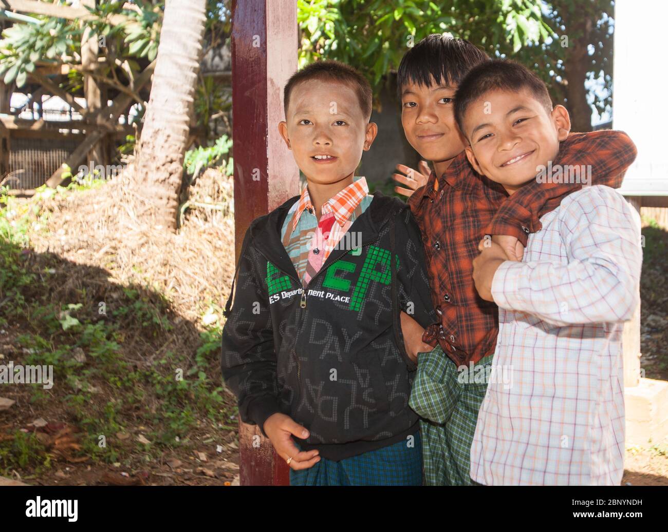 Inle Lake Myanmar - November 3 2013; Three Asian friends boys together smiling and holding one and other. Stock Photo