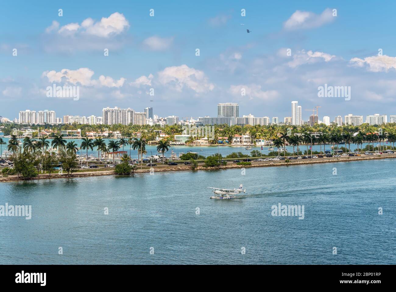 Miami, FL, United States - April 27, 2019: A seaplane landing in the Miami Main channel next to the cruise port of Miami, Florida, USA. Biscayne Bay a Stock Photo