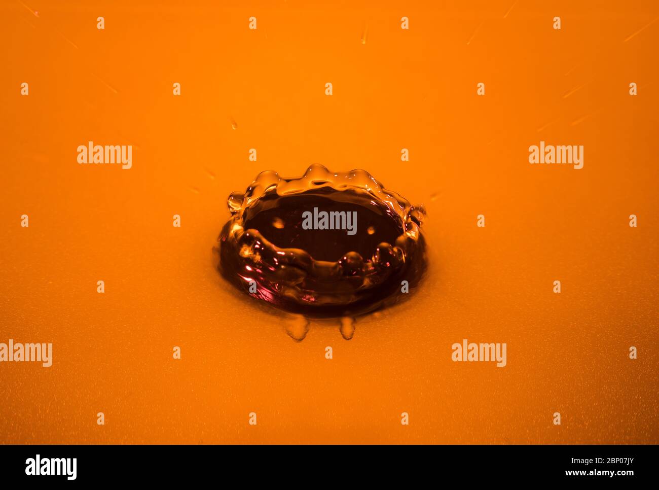Craterlike impact of water droplet on liquid surface seen frozen at