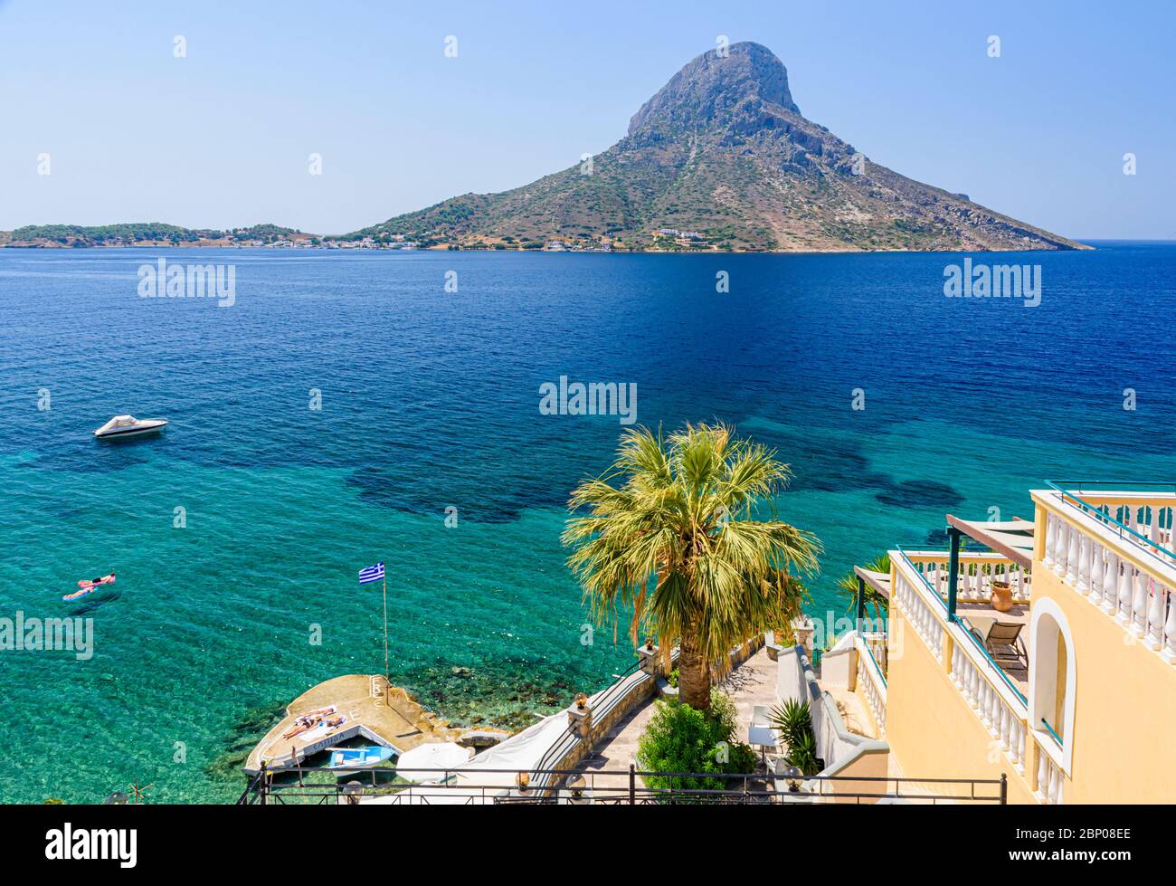 Aegean Sea views towards Telendos Island in the holiday resort town of Masouri, Kalymnos, Dodecanese, Greece Stock Photo