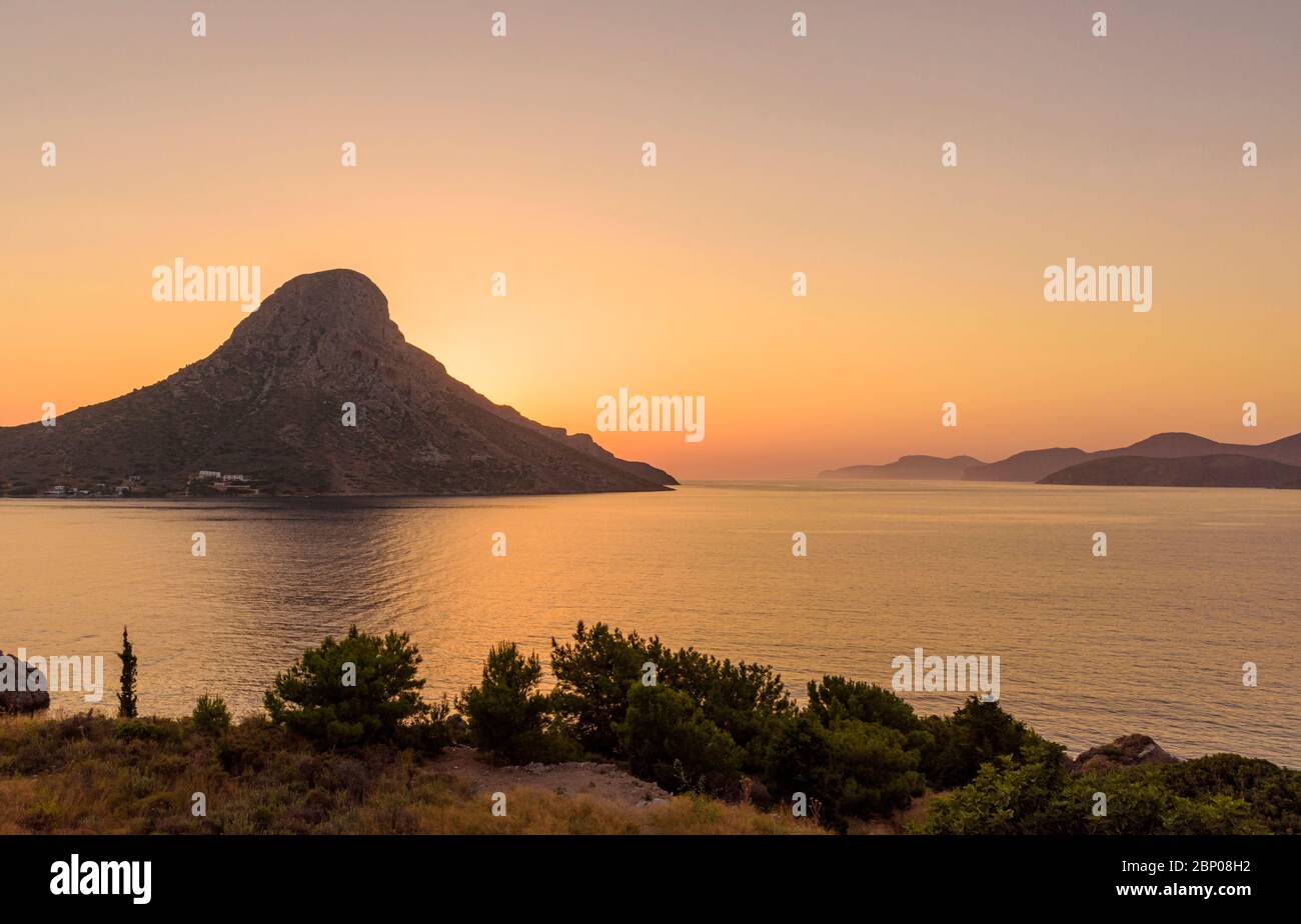Orange sunset over Telendos Island, Kalymnos, Dodecanese, Greece Stock Photo