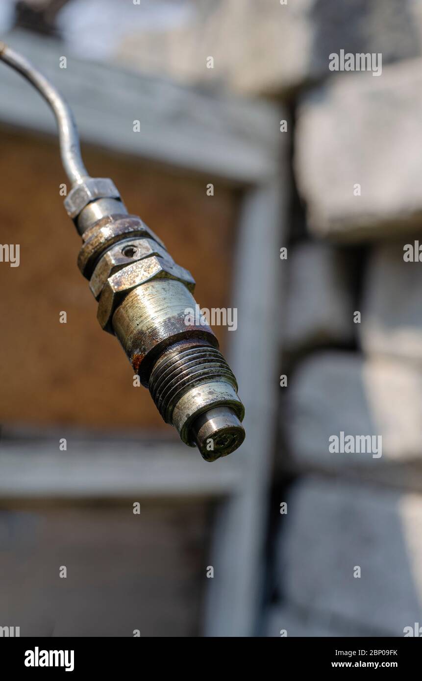 Diesel fuel injector with a drop of fuel. Single fuel injector on a