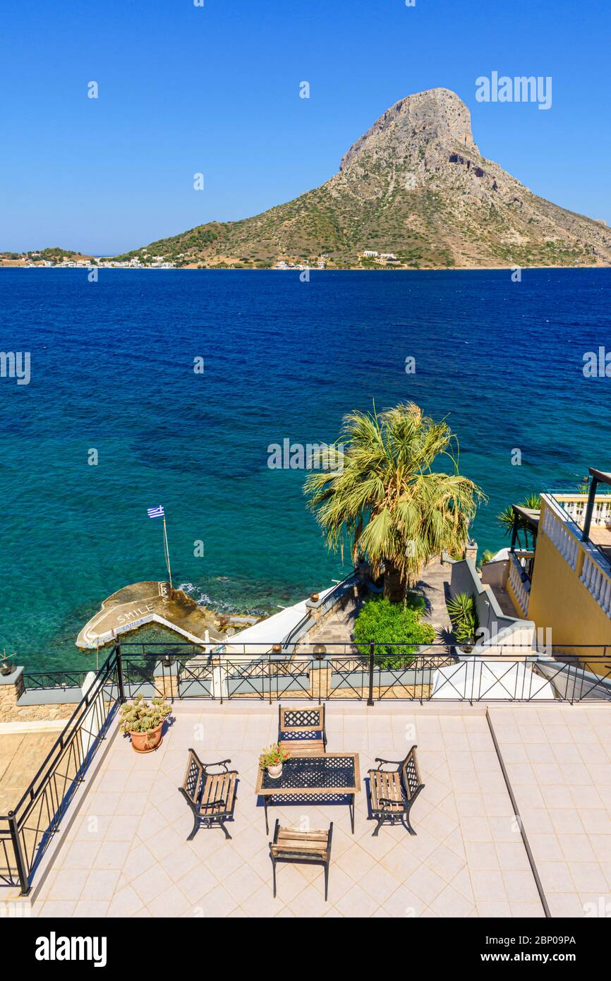 Balcony view towards Telendos Island in the holiday resort town of Masouri, Kalymnos, Dodecanese, Greece Stock Photo