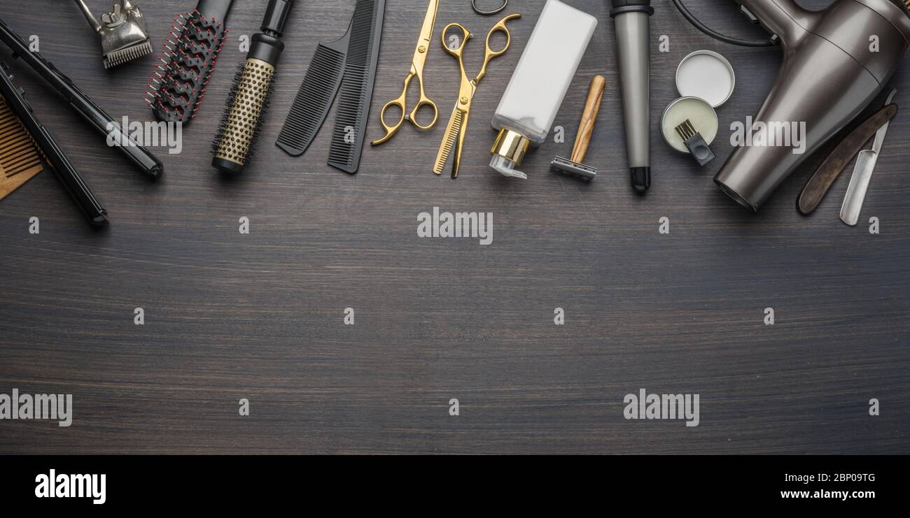 Hairdressing Instruments Classic grooming and hairdressing tools on wooden background. Top view ...