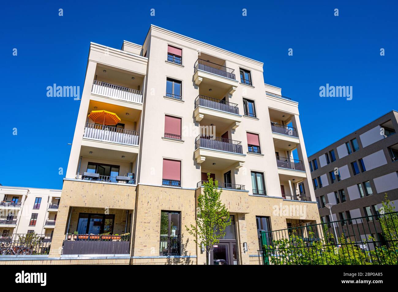 Modern beige multi-family house seen in Berlin, Germany Stock Photo
