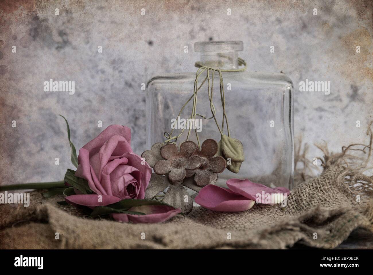 Beautiful vintage look applied to romantic flower and garden paraphenalia still life image with Spring and Summer seasonal blooms Stock Photo