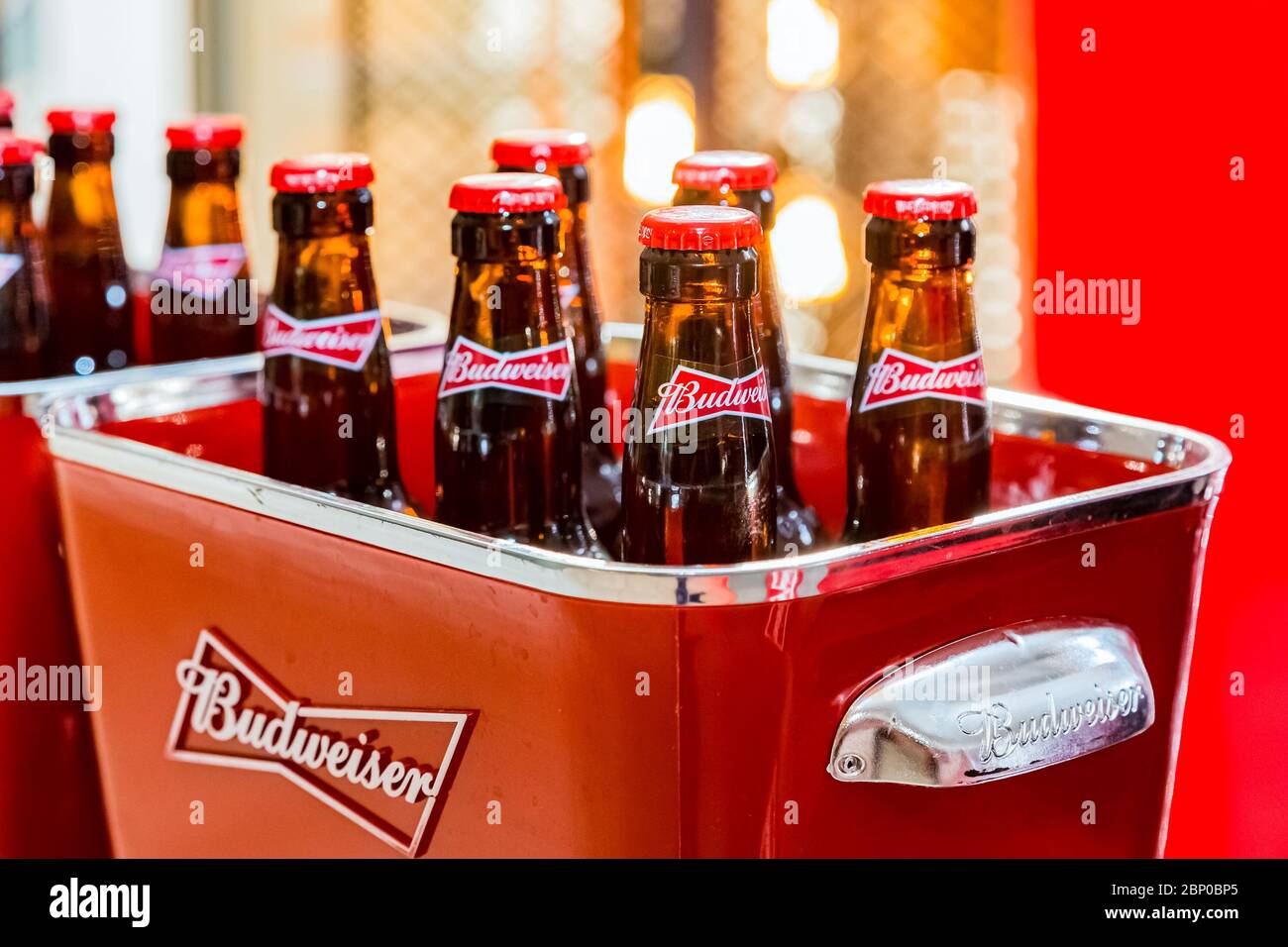 Johannesburg, South Africa - March 27, 2018: Budweiser bottles of beer in red branded ice bucket on bar counter Stock Photo