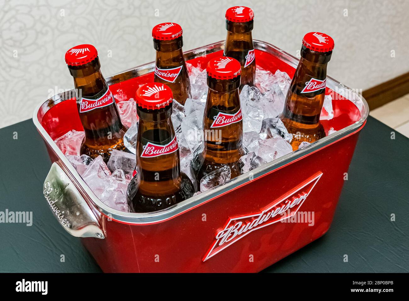 Johannesburg, South Africa - March 27, 2018: Budweiser bottles of beer in  red branded ice bucket on bar counter Stock Photo - Alamy