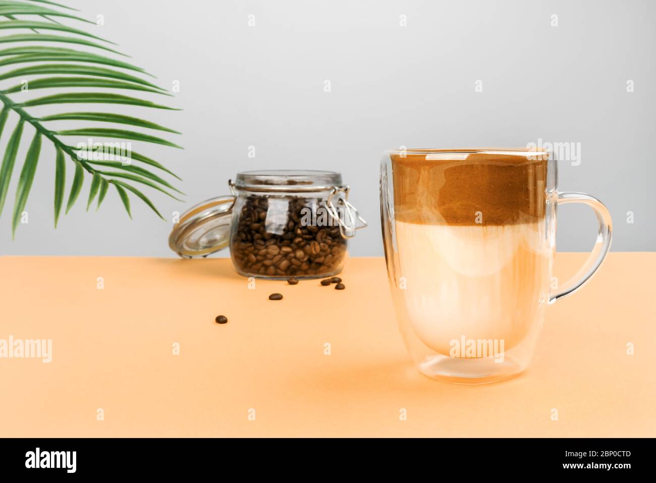 Glass mug with dalgon coffee. Refreshing Korean youth drink Stock Photo