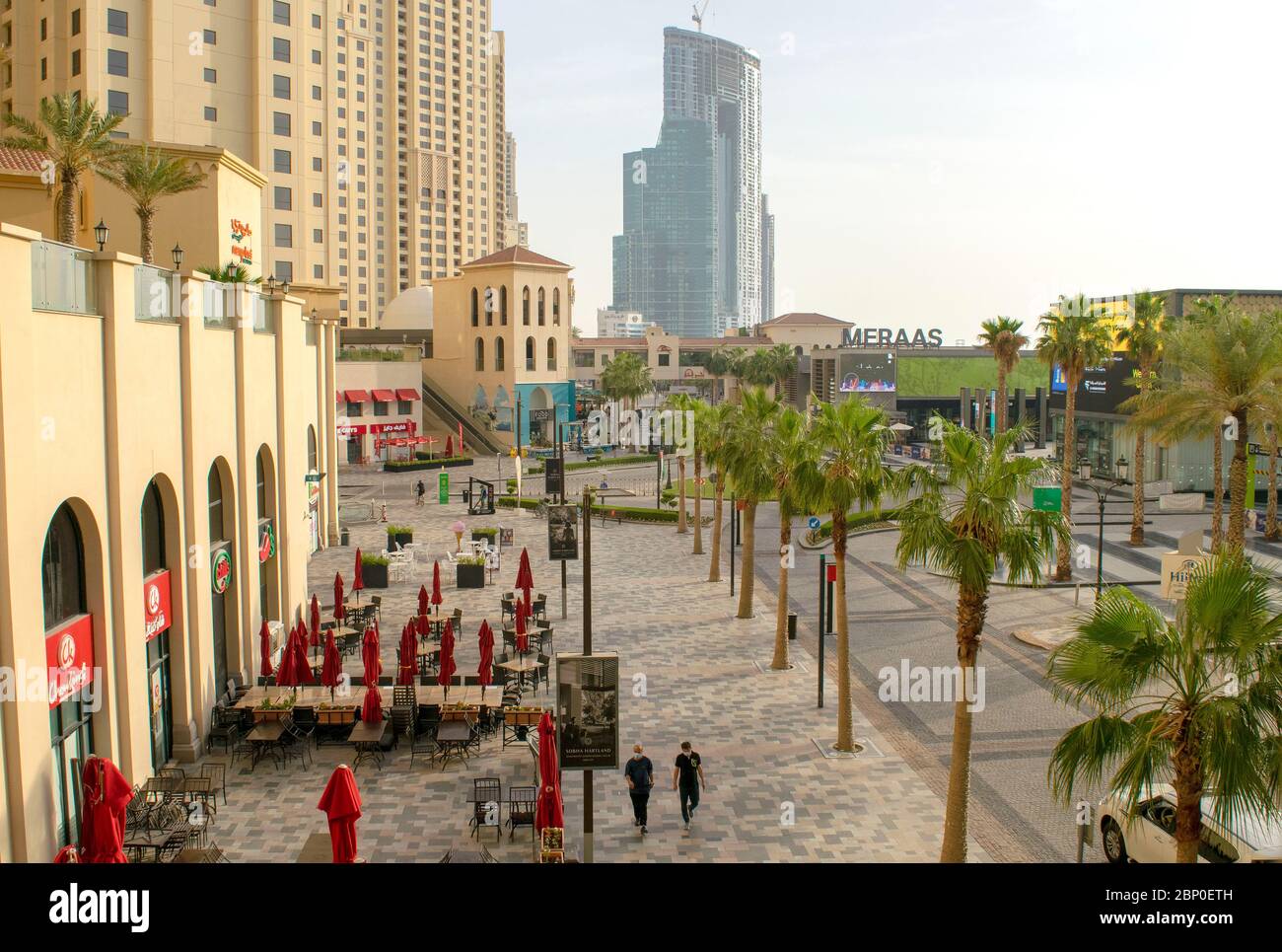 Dubai/UAE - May 7, 2020: Beautiful View on JBR walk and square . Jumeirah Beach Residence. Dubai road with light traffic and walking during day. Top v Stock Photo