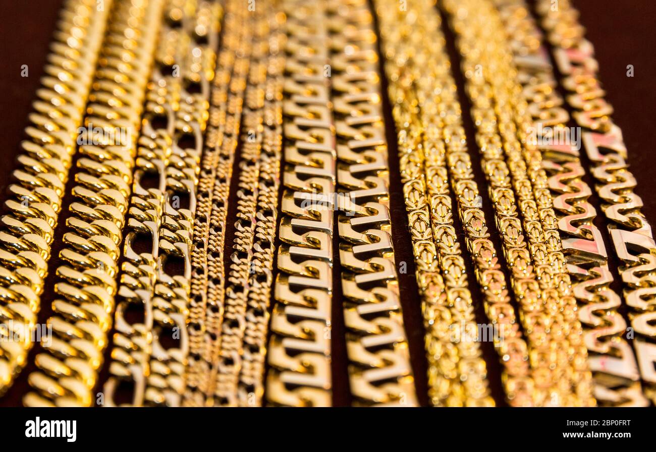 A collection of different types of heavy golden chains Stock Photo - Alamy