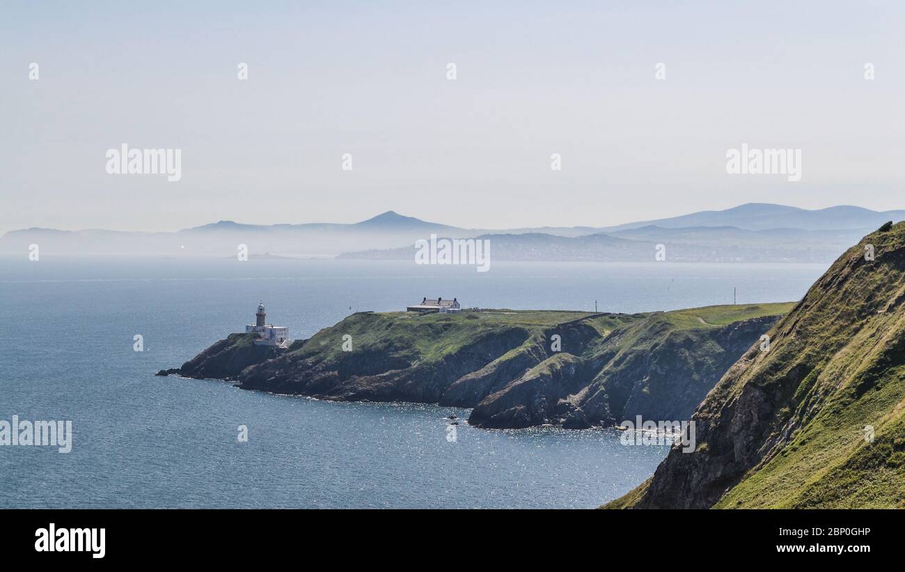 Howth Head with Baily Lighthouse, Dublin, Ireland. Howth peninsula during irish summer daytime. Stock Photo