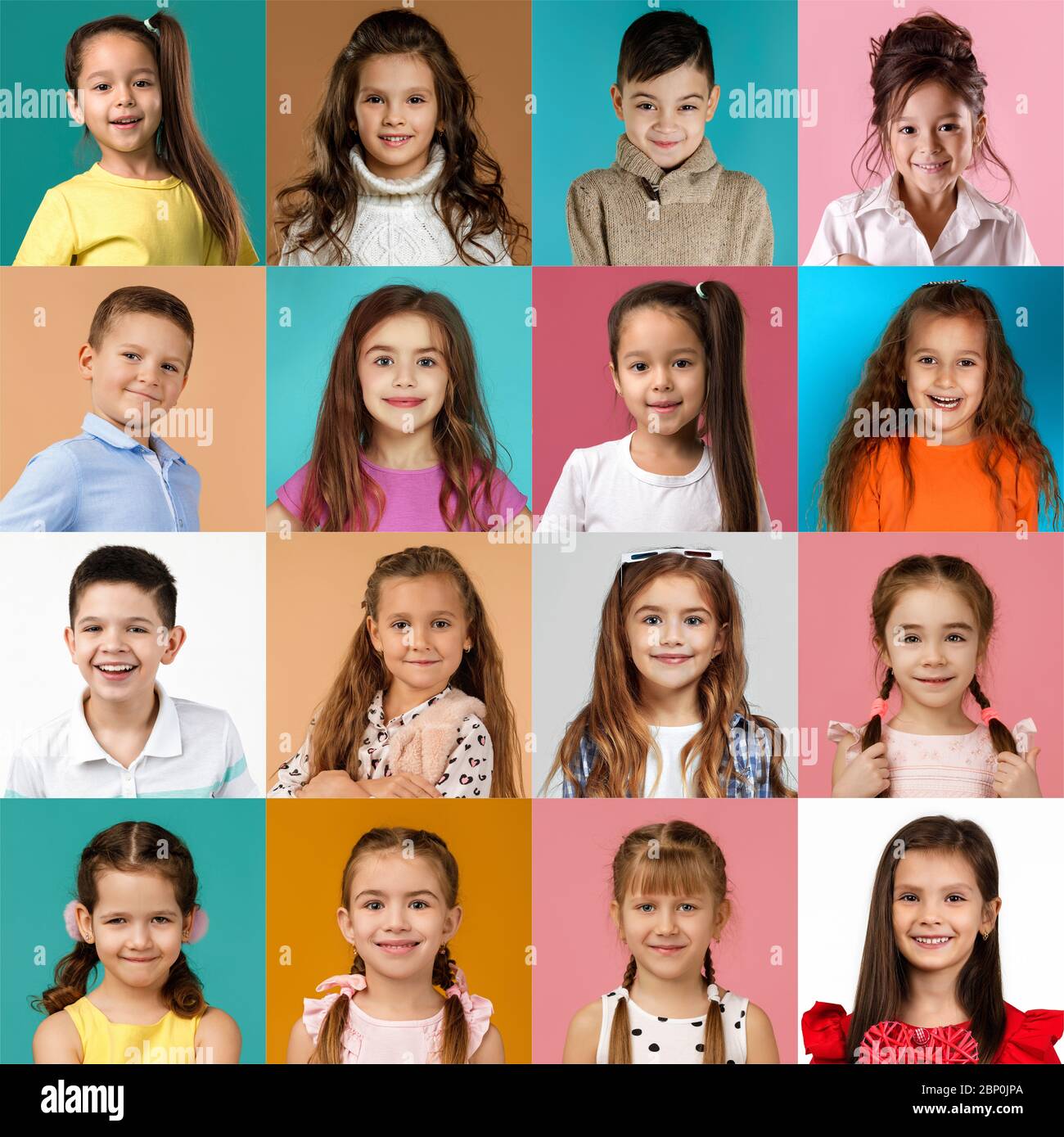 collage of happy smiling faces of kids. Happy child girls and boys expressing different positive emotions. Human emotions, facial expression concept. Stock Photo