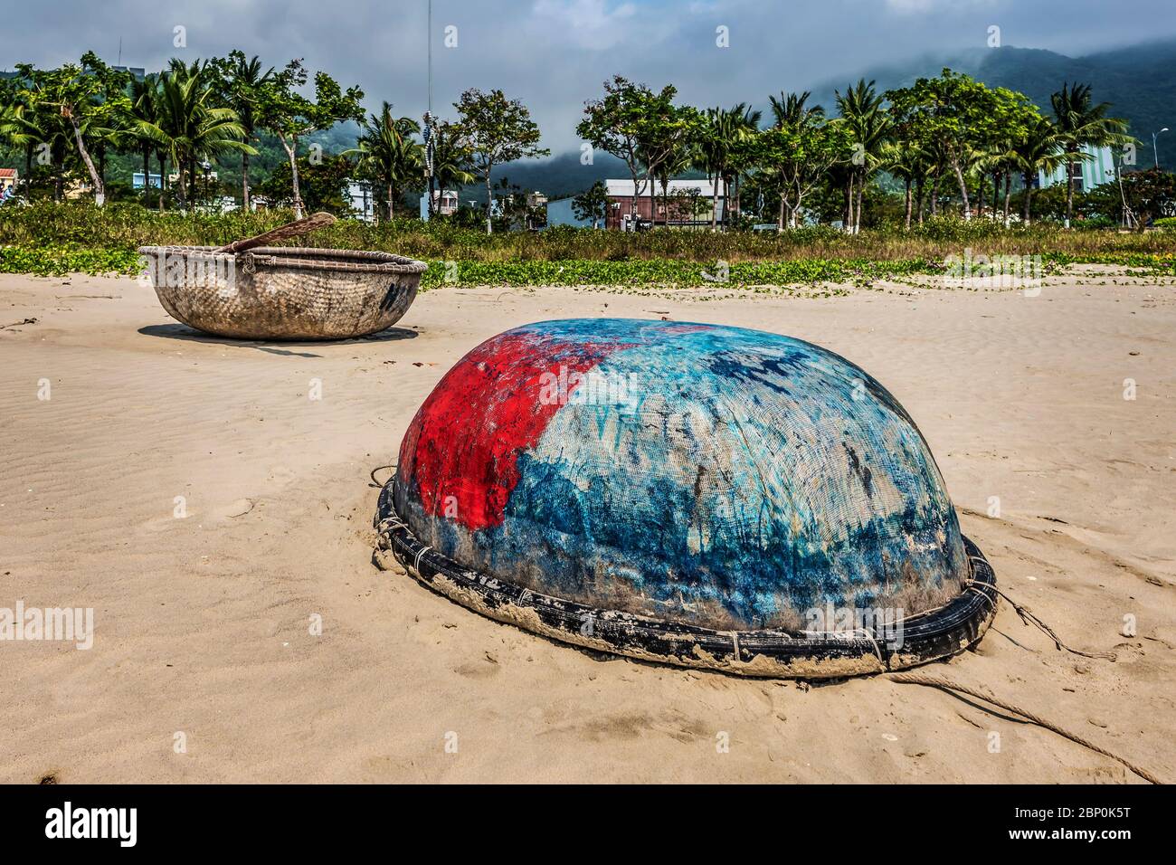 Fishing boat lying on the beach Stock Photo - Alamy