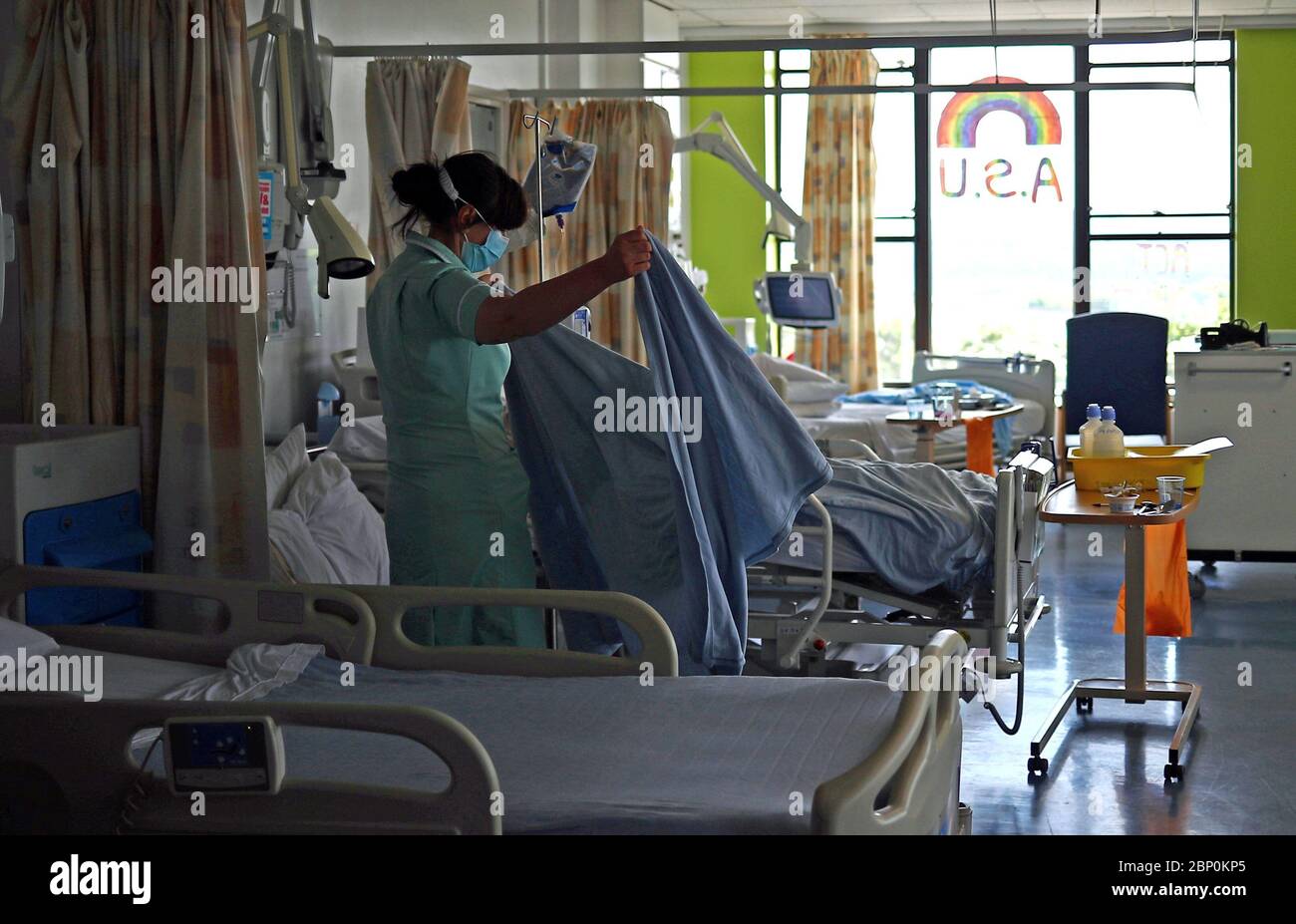 A health care assistant works on the Acute Stroke Unit at The Royal Blackburn Teaching Hospital in East Lancashire during the outbreak of the coronavirus disease. Stock Photo