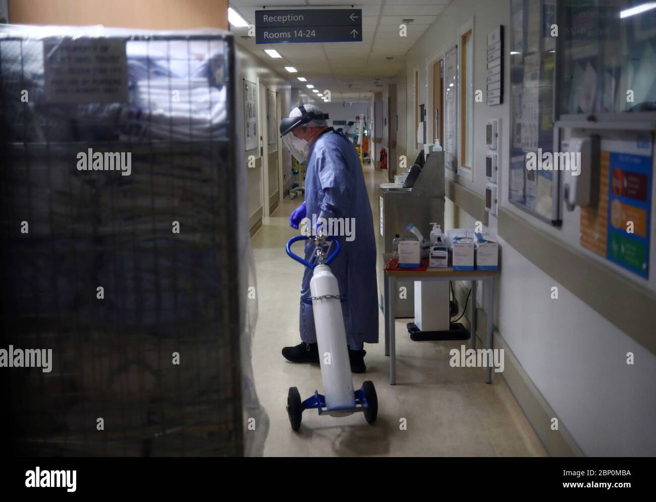A medical worker moves an oxygen tank in the Critical Care Unit at The Royal Blackburn Teaching Hospital in East Lancashire during the outbreak of the coronavirus disease. Stock Photo