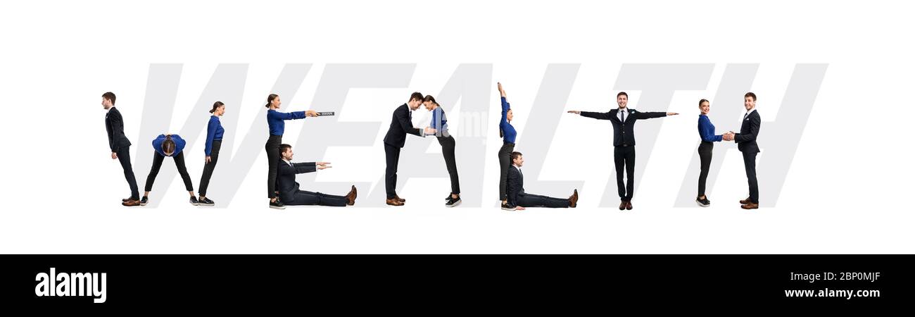 Group of people forming wealth word at studio Stock Photo - Alamy