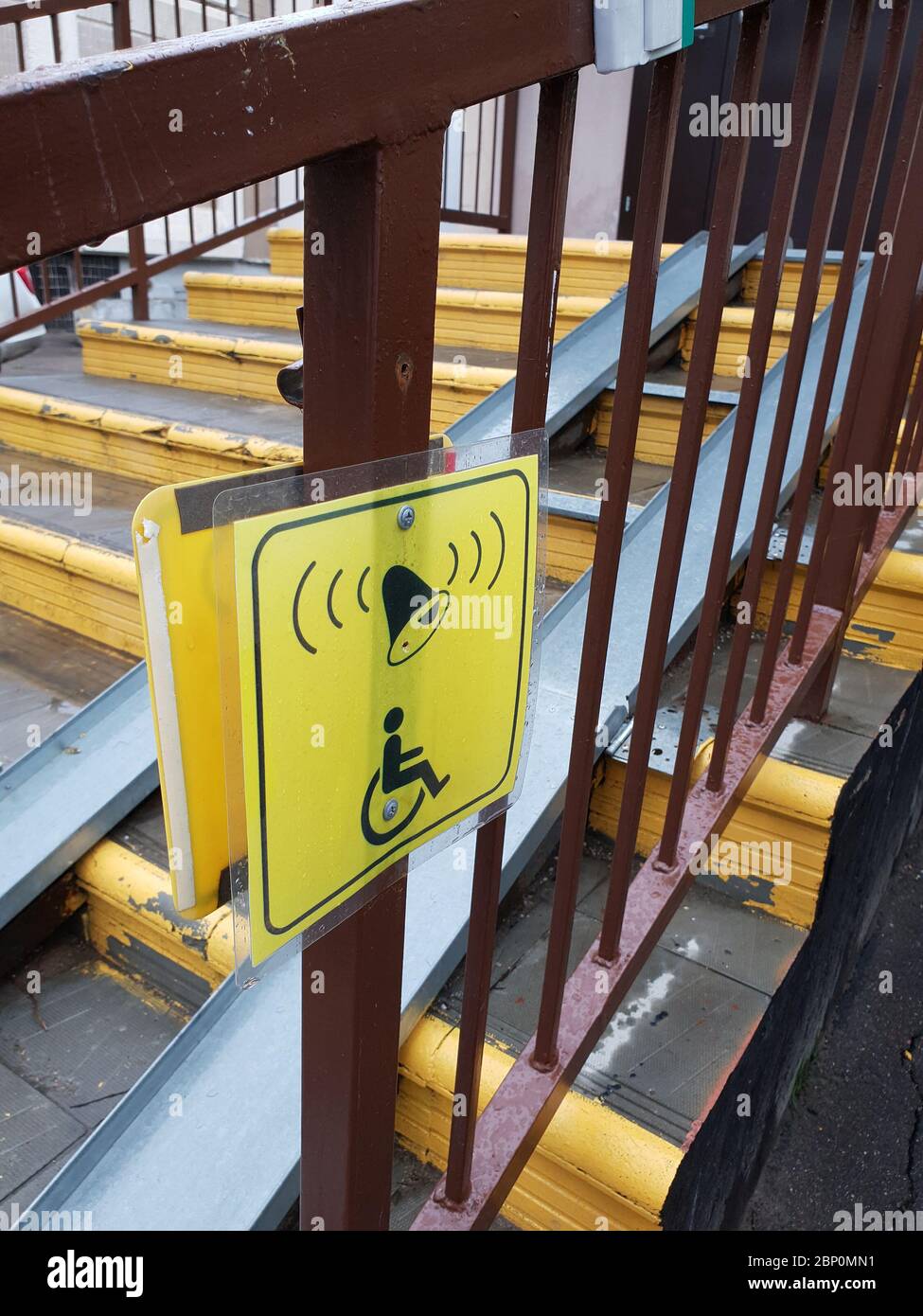 Information signs for people with disabilities near ramp on steps stock