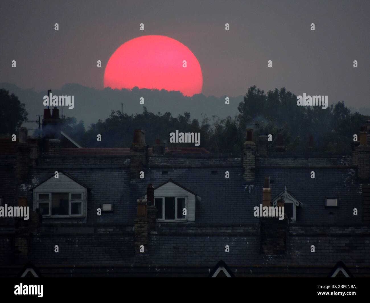 Whitby Sun Unusual freak weather conditions with a big red sun setting over the ...
