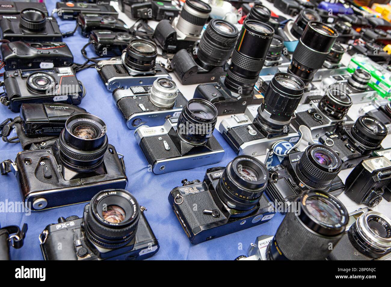 Old analogue film cameras for sale on a market stall Stock Photo