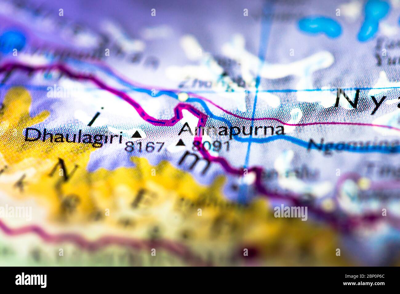 Shallow depth of field focus on geographical map location of Mount