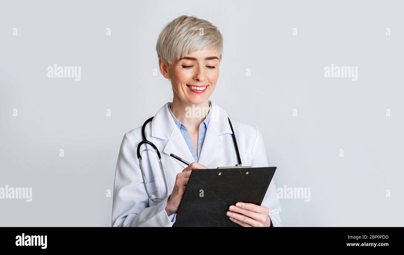 Doctor prescribe medication. Smiling woman in uniform Stock Photo Alamy