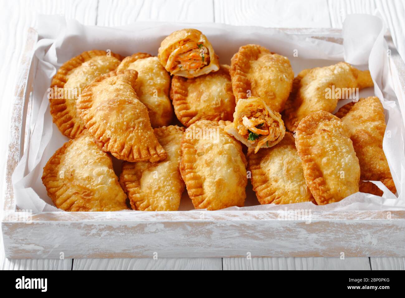 delicious deepfried RedHot Buffalo Chicken Empanadas in a rustic