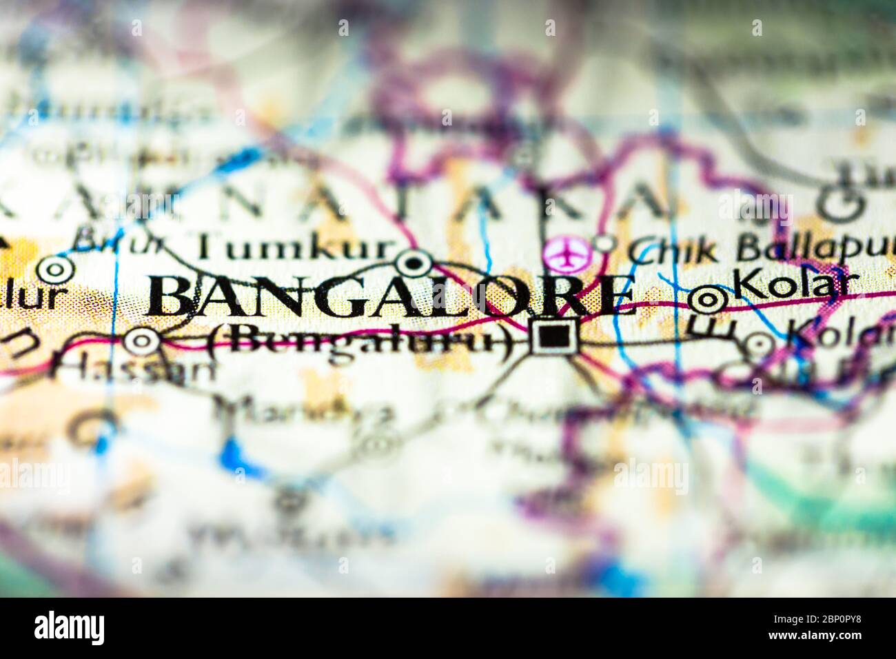 Shallow depth of field focus on geographical map location of Bangalore Bengaluru city in Karnataka India Asia continent on atlas Stock Photo