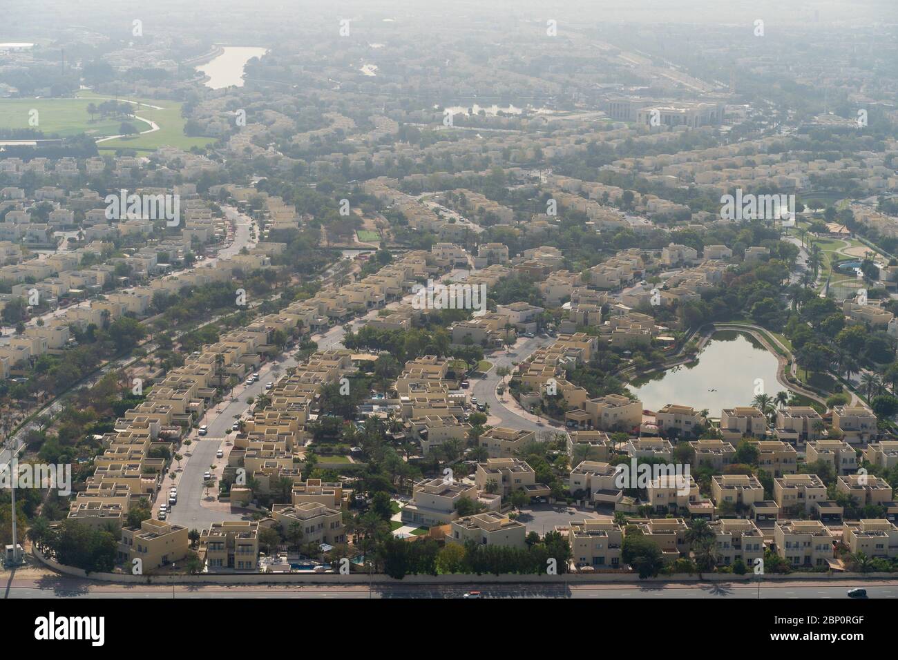 Aerial view of Dubai with villas and houses of local residents in morning dusk, United Arab Emirates. Stock Photo