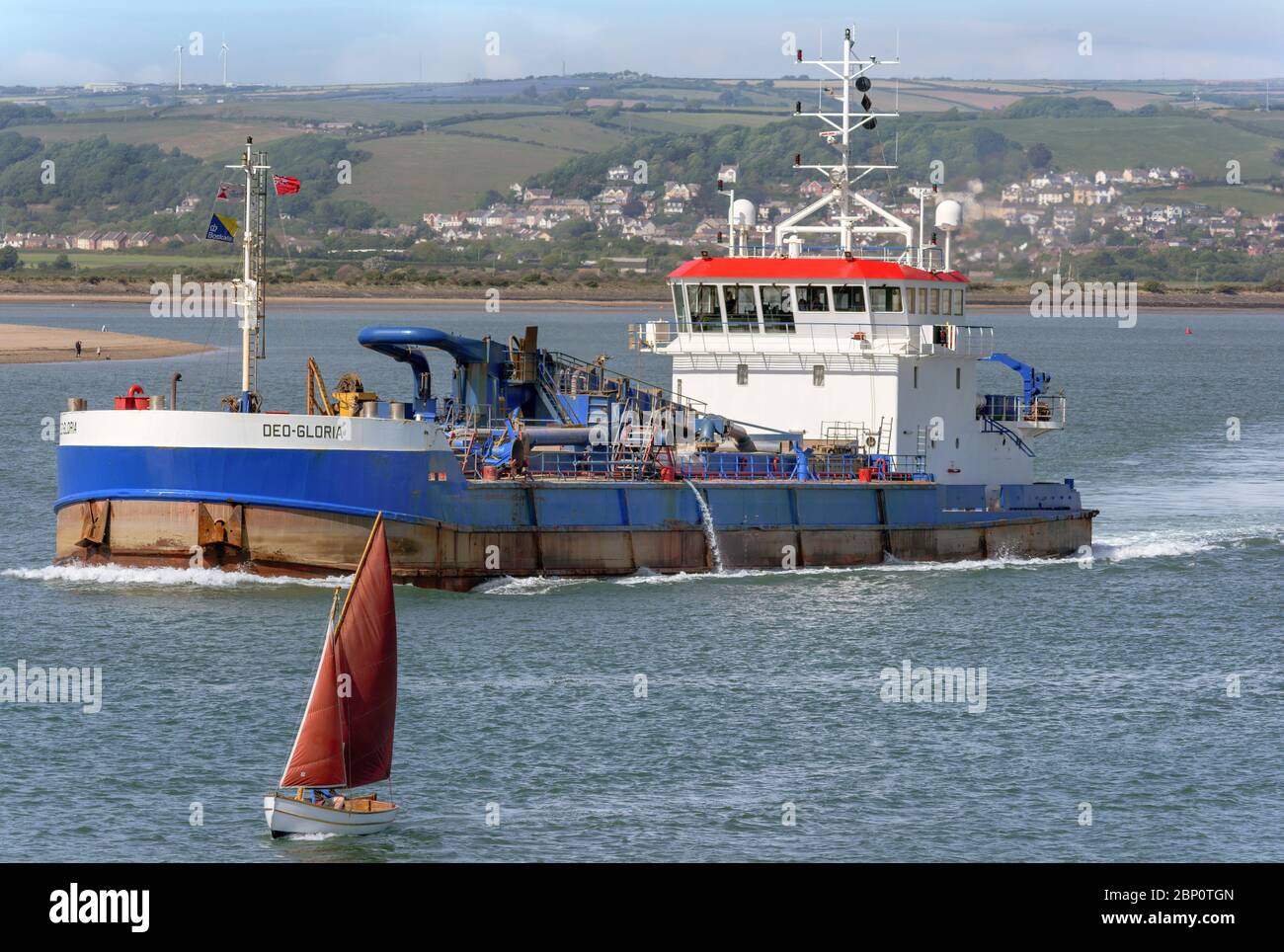 The DEO Gloria setting out from the River Taw in North Devon towards the Bristol Channel. The vessel is a Trailing Suction Hopper Dredger IMO 7711074. Stock Photo