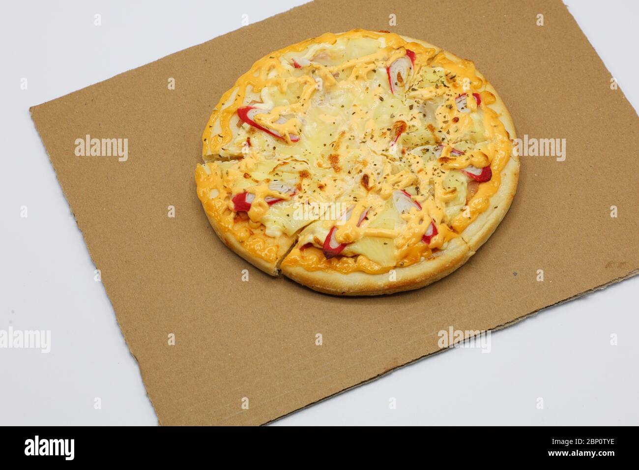 Pizza with chicken and sausage isolated on white background. Stock Photo