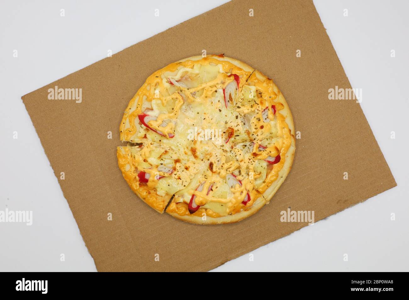 Pizza with chicken and sausage isolated on white background. Stock Photo
