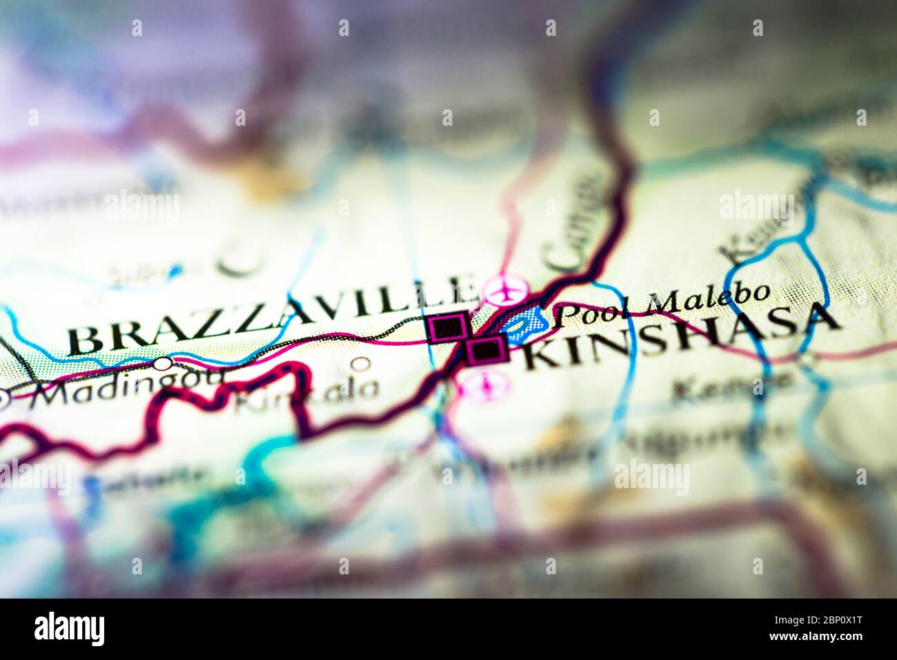 Shallow depth of field focus on geographical map location of Kinshasa Brazzaville twin city in Democratic Republic of the Congo Africa continent on at Stock Photo