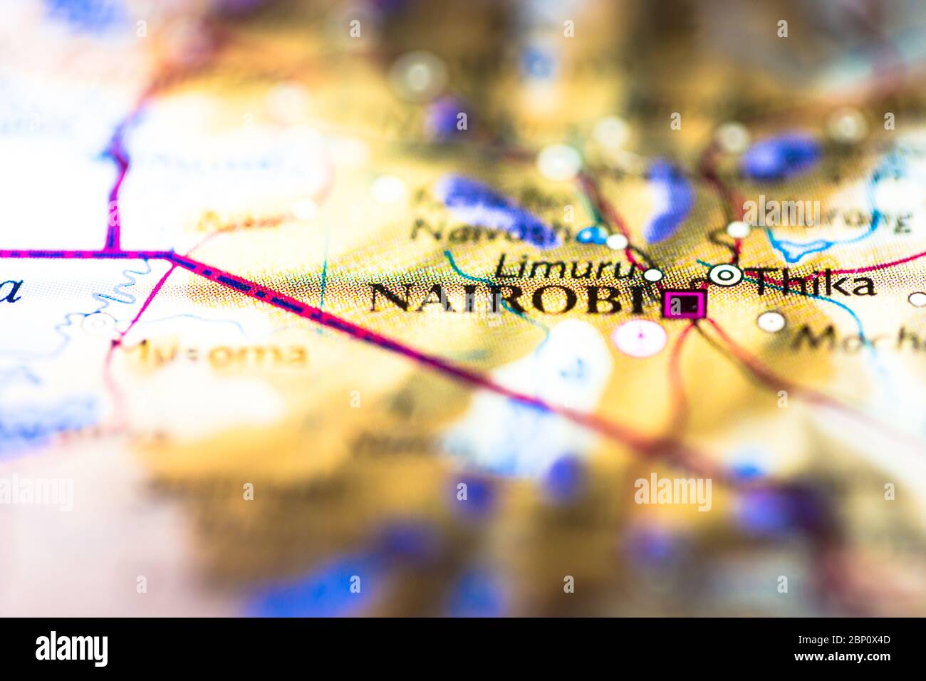 Shallow depth of field focus on geographical map location of Nairobi city in Kenya Africa continent on atlas Stock Photo