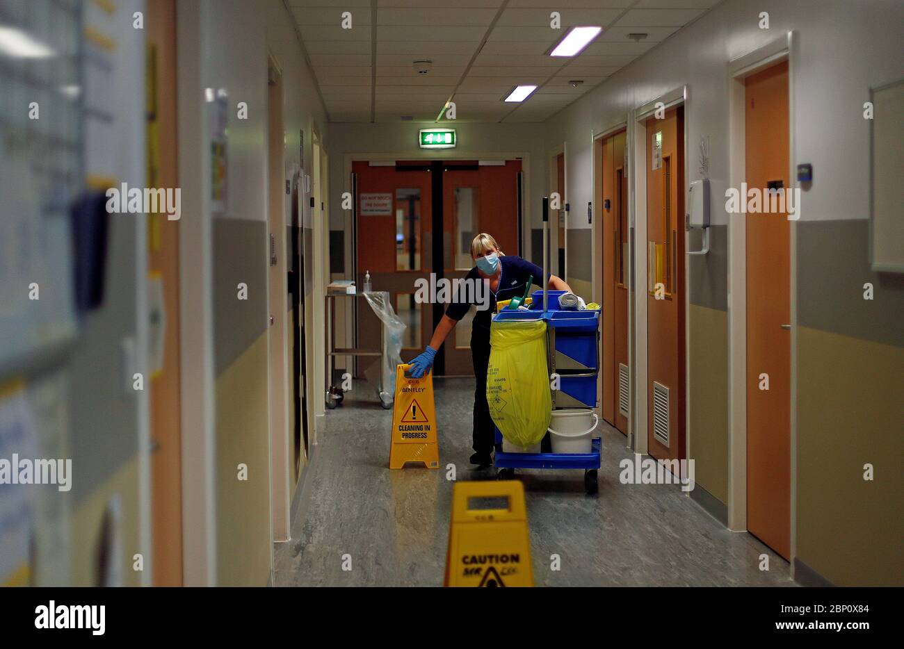 A member of staff pushes a cleaning trolley through the Critical Care Unit at The Royal Blackburn Teaching Hospital in East Lancashire during the outbreak of the coronavirus disease. Stock Photo