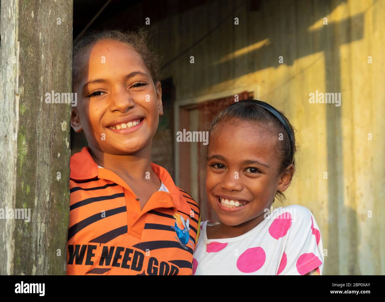 Young girls posing for camera, Sigatoka (Singatoka), Fiji. Stock Photo