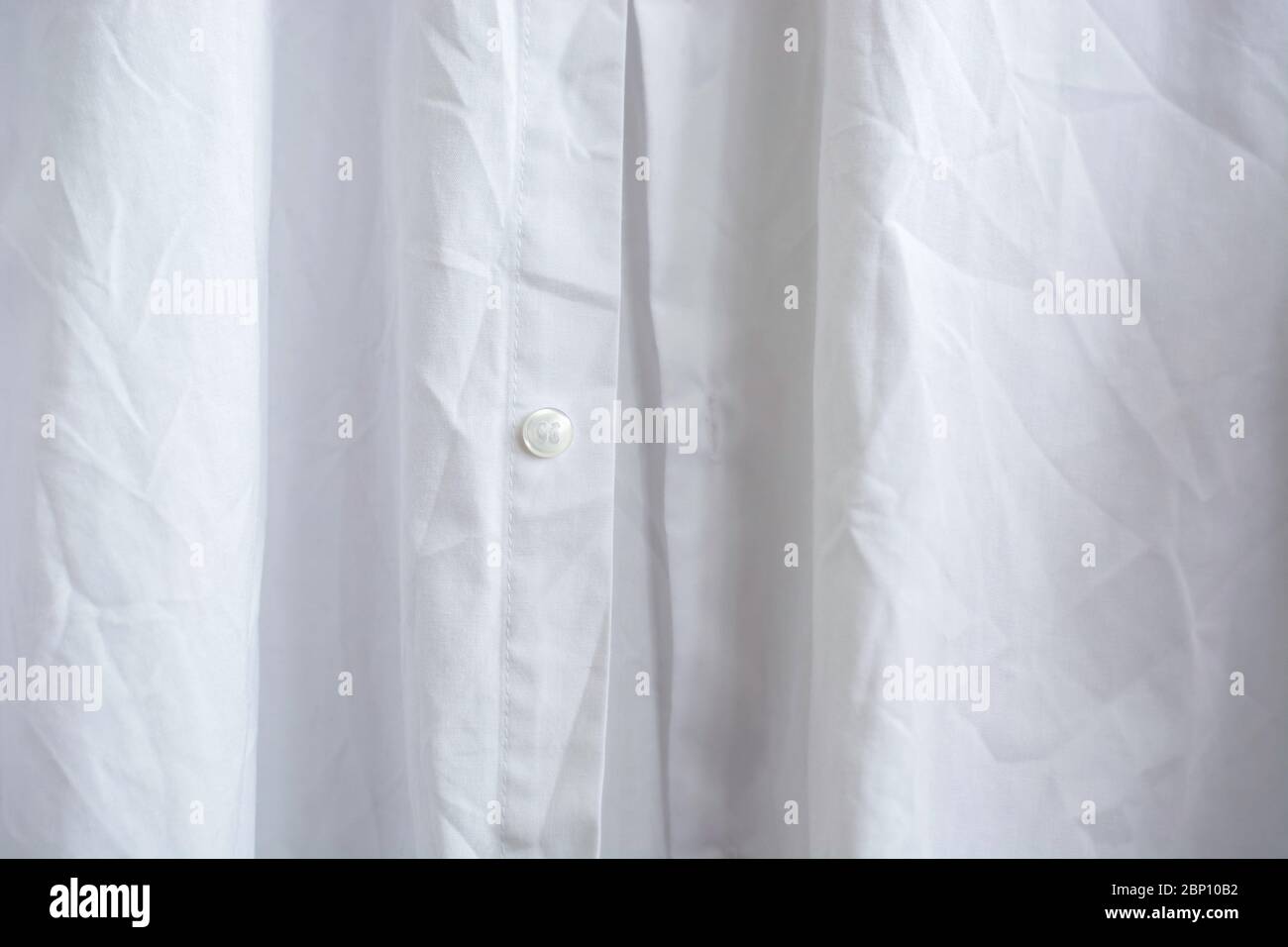 Close up wrinkled white classic long sleeve mens shirt Stock Photo