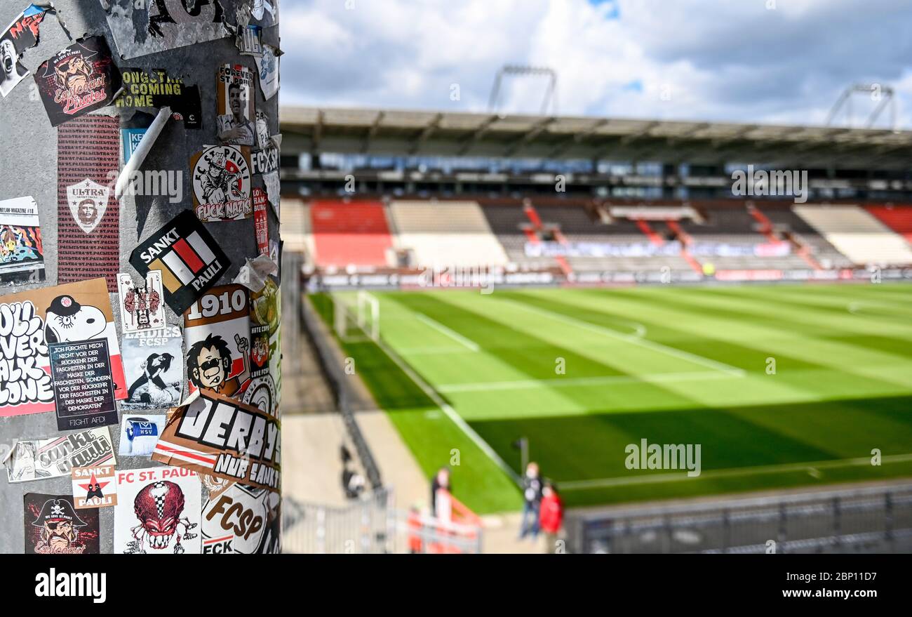 Hamburg, Germany. 17th May, 2020. Football: 2nd Bundesliga, FC St. Pauli - 1st FC Nürnberg, 26th matchday at the Millerntor stadium. Stickers of football fans are stuck on the empty stadium ranks. Credit: Axel Heimken/dpa - Pool/dpa - IMPORTANT NOTE: In accordance with the regulations of the DFL Deutsche Fußball Liga and the DFB Deutscher Fußball-Bund, it is prohibited to exploit or have exploited in the stadium and/or from the game taken photographs in the form of sequence images and/or video-like photo series./dpa/Alamy Live News Stock Photo