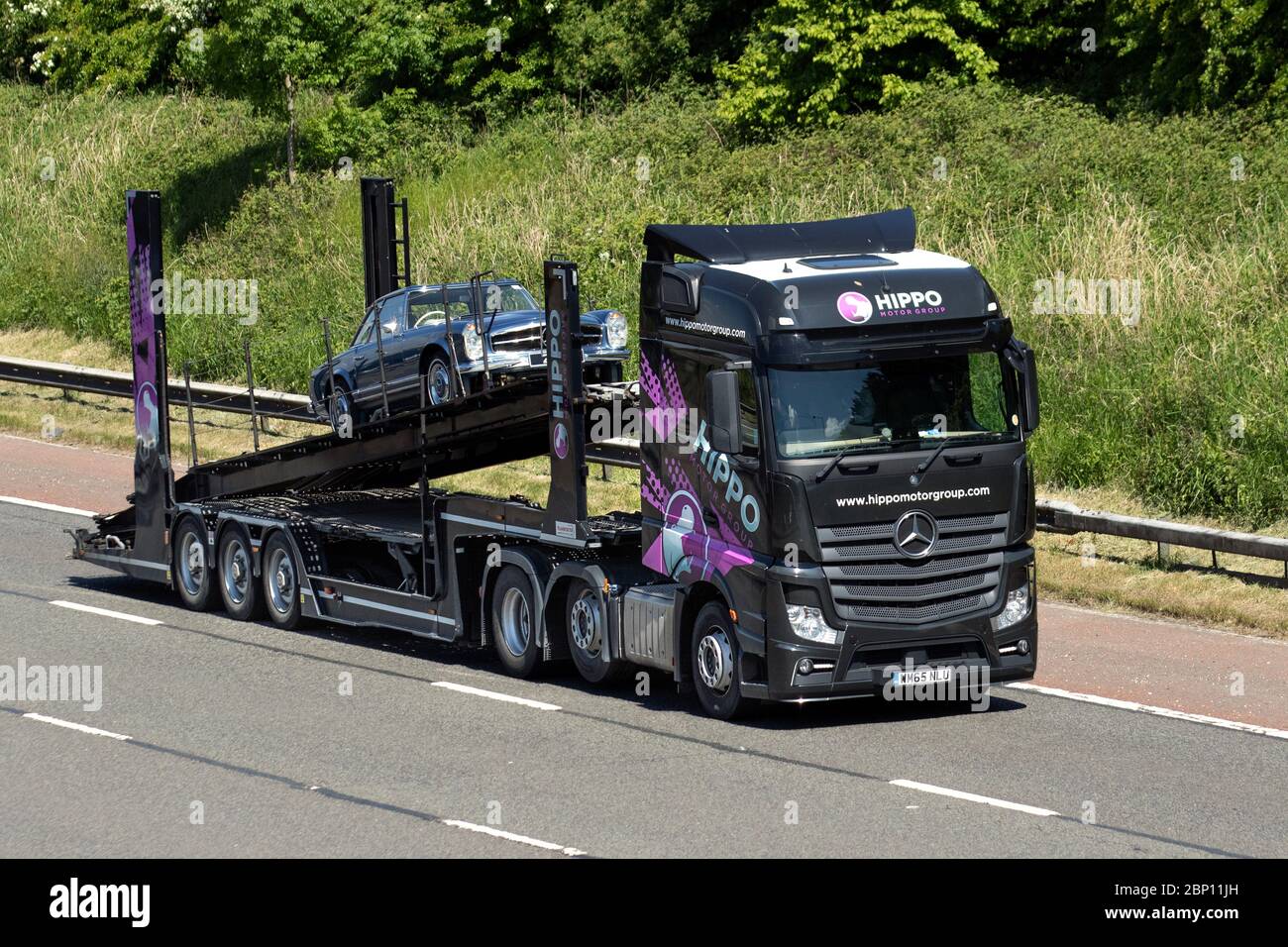 Auto transporter, car transporter carrier carrying one car; Motorway
