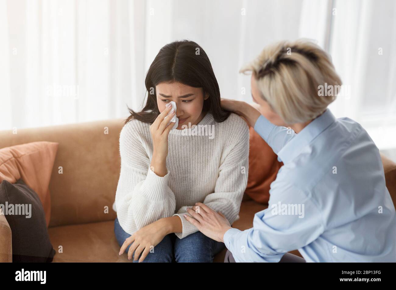 Psychologist Supporting Crying Girl During Psychotherapy Session