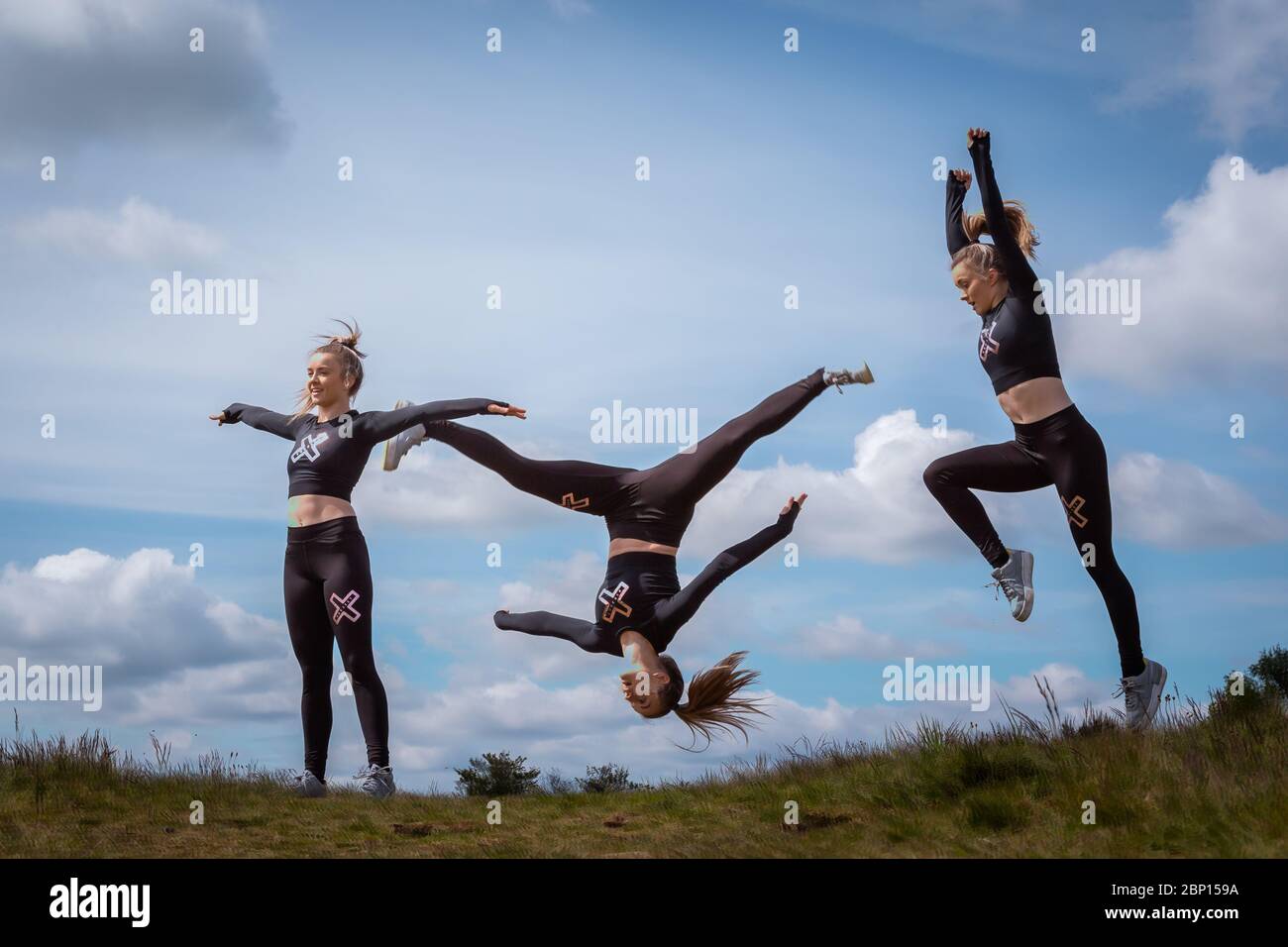 Acrobatics in the park, Waseley Hills, Worcs, UK. 17th May, 2020. After the slight easing of the lockdown in England, 15-year-old Amelia Hubbard can at last practice her acrobatic dance moves in her local open space at Waseley Hills Country Park, Worcestershire, rather than in her back garden at home. This is an in-camera multiple exposure. Amelia is hoping to take up a place at Birmingham Ormston Academy to study Dance full time, and is happy that she has not needed to take her GCSE exams this year due to schools being closed. Credit: Peter Lopeman/Alamy Live News Stock Photo