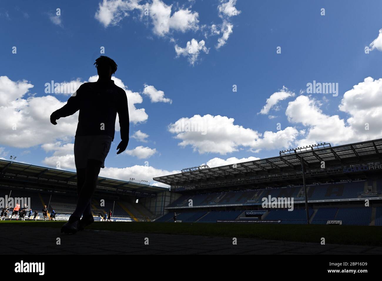 Westphalia, Germany. 17th May, 2020. FILED - 17 May 2020, North Rhine-Westphalia, Bielefeld: Football, 2nd Bundesliga, DSC Arminia Bielefeld - VfL Osnabrück, 26th matchday, Schüco-Arena: Players leave the pitch after warming up for the game. After a 65-day corona break, the ball is rolling again in the Bundesliga. The matches take place without spectators. Photo: Stuart Franklin/Getty/POOL/dpa - IMPORTANT NOTE: In accordance with the regulations of the DFL Deutsche Fußball Liga and the DFB Deutscher Fußball-Bund, it is prohibited to exploit or have exploited in the stadium and/or from the game Stock Photo