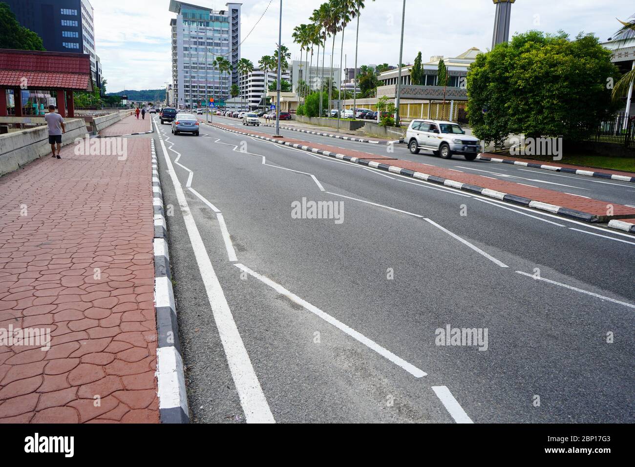 Sidewalk and road with marking in Bandar Seri Begawan, the capital of Brunei which is the small country on Borneo Stock Photo