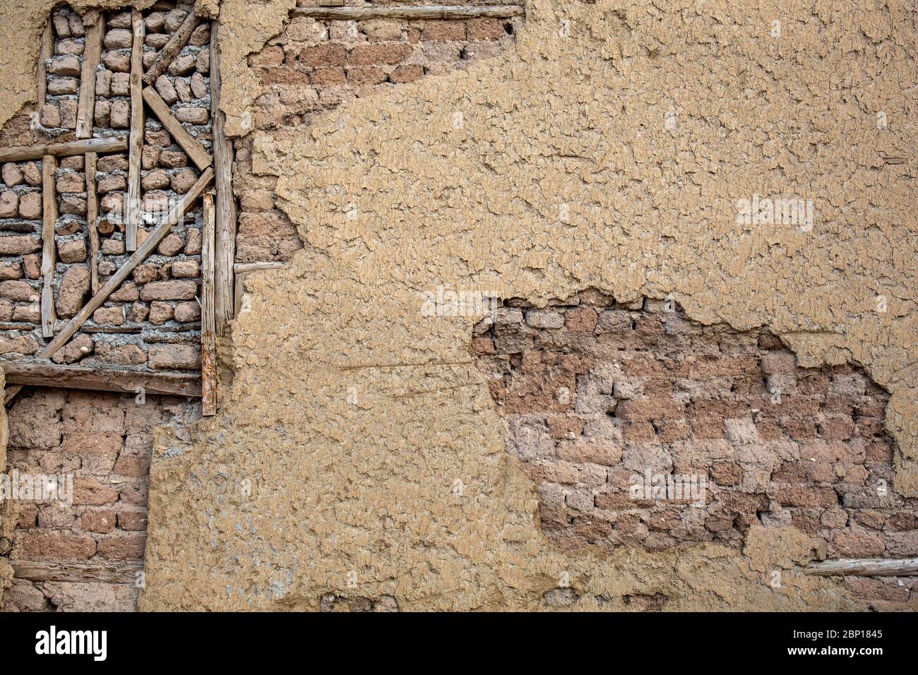 Detail from the weathered mud brick wall of an old house in Odun Pazari district of Eskisehir, Turkey. Stock Photo