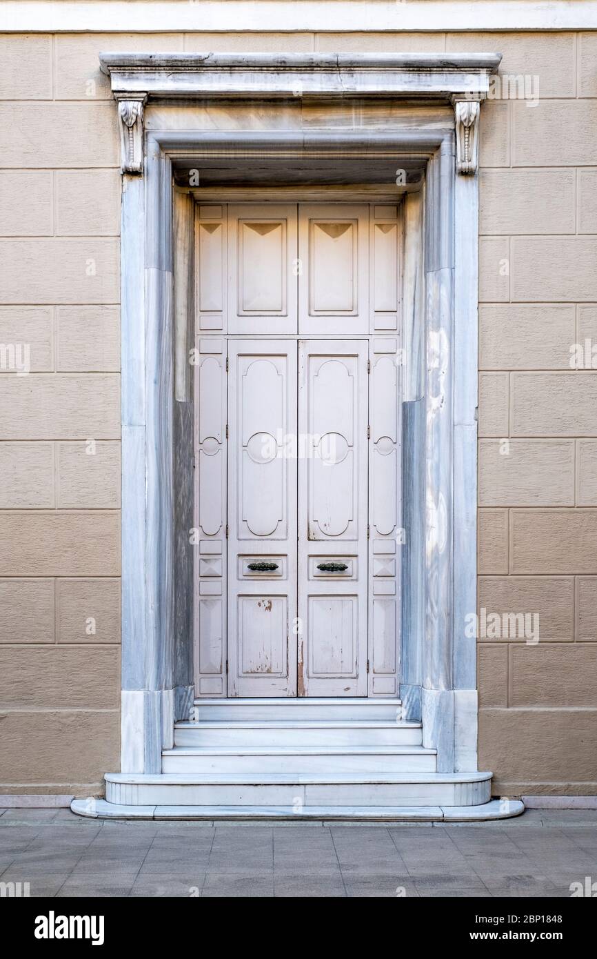 Closed old white wooden house door. Stock Photo