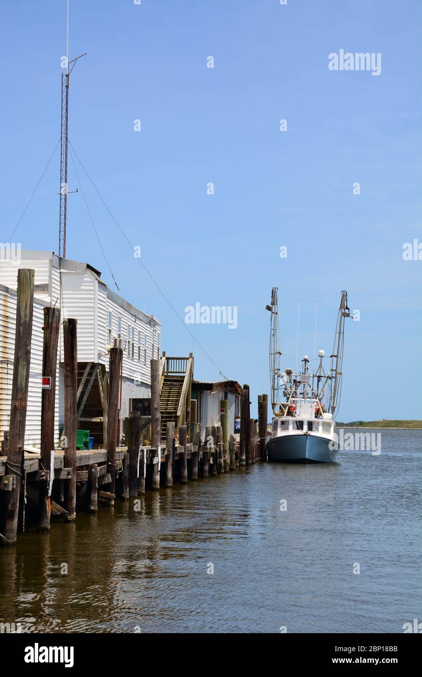 The Wanchese fishing industry supports a modest number of commercial fishing trawlers on the southern end of Roanoke Island. Stock Photo