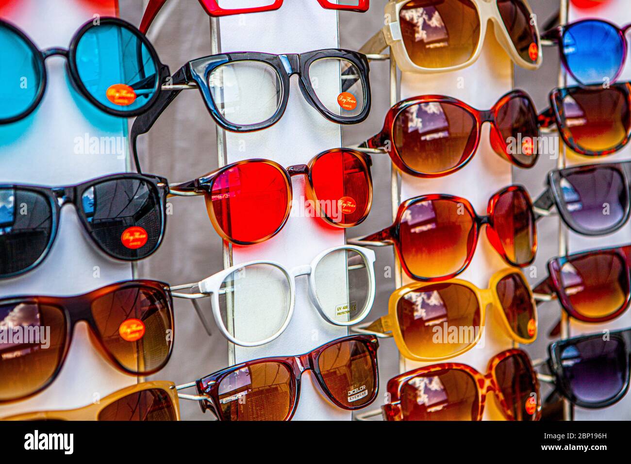 Sunglasses displayed on a market stall Stock Photo Alamy